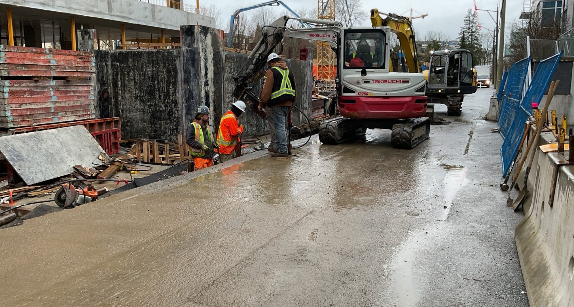 Lil Bear Contracting crew and excavator on a civil construction site